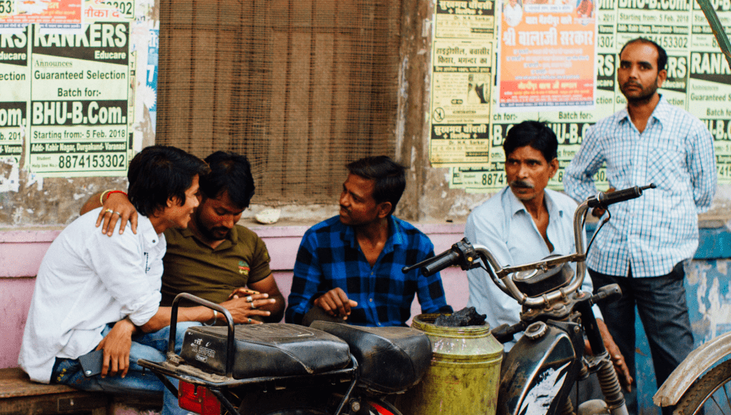 Men in an alley in Varanasi, India. Photo by Adam Cohn, courtesy of Flickr Creative Commons.