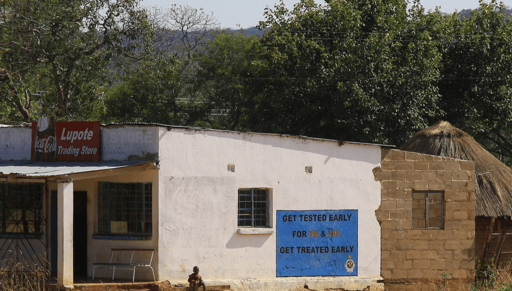 Store shows sign encouraging testing for TB and HIV in Zimbabwe. Photo by Jin Jeong.